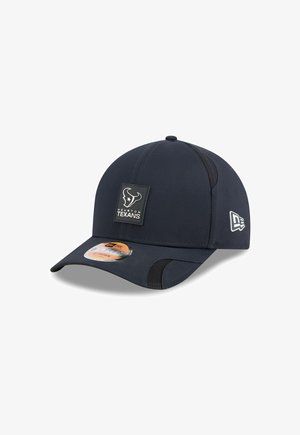 Navy baseball cap with a structured design, featuring a Houston Texans logo patch, mesh side panels, and a curved visor.