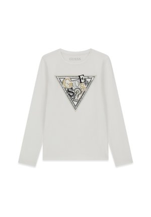 Chemise blanche à manches longues avec un grand motif triangulaire au centre comprenant plusieurs lettres et le chiffre 81 en noir et beige.
