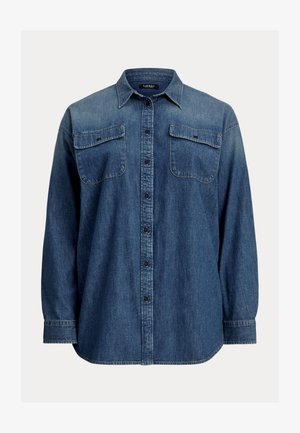 Camisa de ganga em azul escuro com mangas longas, fecho de botão, dois bolsos no peito e um colarinho clássico. Apresenta um corte descontraído e uma bainha curvada.