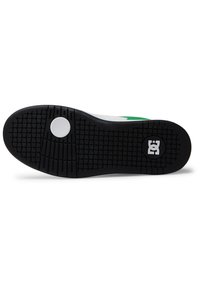 Black rubber outsole with a textured grip pattern, featuring a circular white accent and a logo in the bottom right corner.