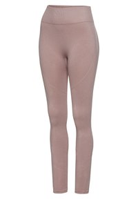 Skinny legging in soft pink fabric. High waist design with textured patterns along the sides. Stretchy material suitable for active wear.