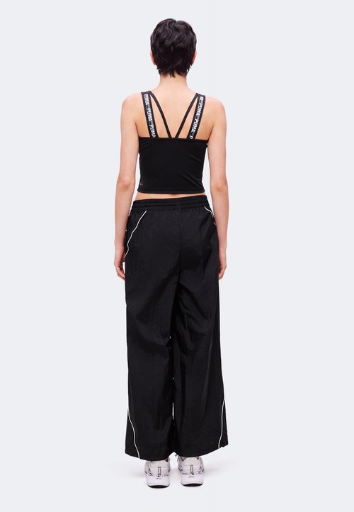 PUMA SPORT RELAXED WOVEN PANTS - Tracksuit bottoms - black — photo 3