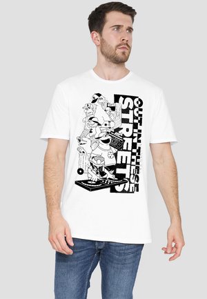White cotton t-shirt featuring a bold black graphic of characters and the text "OUT IN THESE STREETS," with various playful designs and details.