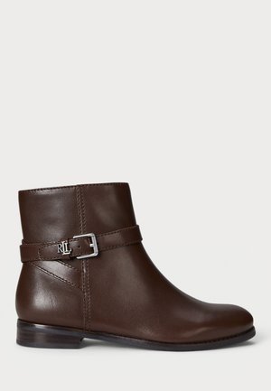 Brown leather ankle boot featuring a rounded toe, a side buckle accent, and a low stacked heel with subtle stitching details.