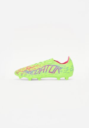 Bright green soccer cleat with pink accents, featuring a textured upper and bold "PREDATOR" branding, designed for performance on grass surfaces.