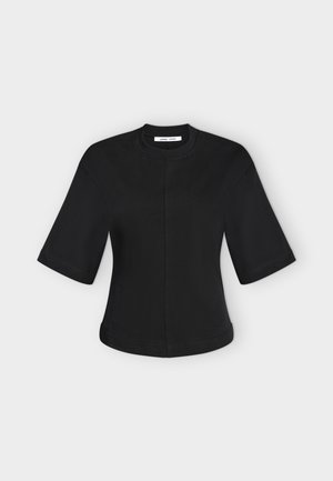Haut noir à manches courtes avec col rond haut et détail de couture centrale, présenté à plat sur un fond clair.
