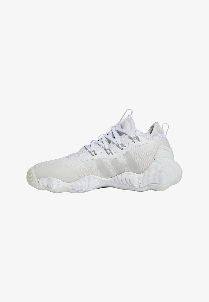 Witte sportieve schoenen met een soepel fabric en rubberen zool, met subtiele grijze accenten, een gestructureerde bovenkant en een traditionele vetersluiting.
