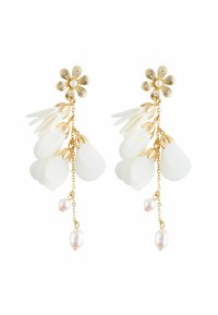 White flower-shaped drop earrings feature gold hardware, cascading petal-like layers, and small pearl accents. Elegant and lightweight design.