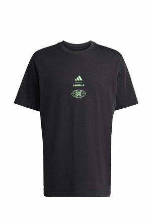 Sort bomulds T-shirt med korte ærmer. Har grøn logo-tekst "LES MILLS" og "LIVE 25" på forsiden, over et cirkulært design.