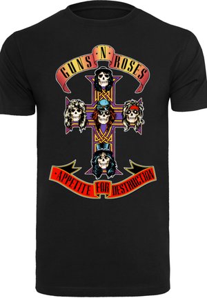 Černé tričko s barevným grafickým designem lebek a kříže. Text zní "Guns N' Roses" a "Appetite for Destruction."
