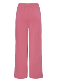 Pantalon à jambes larges avec taille élastique en rose poudré uni et discret, en tissu doux et léger, conçu pour le confort et un usage décontracté.