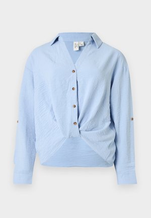 Light blue long-sleeve blouse with V-neck, button front, twist detail at hem, and button tabs on sleeves for rolling up.