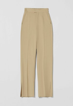 Beige hoge taille wijde broek met elastische tailleband, zijzakken, voorplooien en kleine zijsplitjes aan de zoom.
