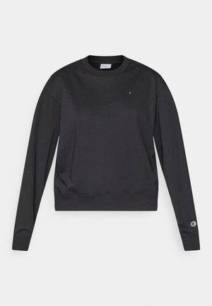 Mustast puuvillasegust kangast pika varrukaga dressipluus. Omaduseks soonikkoeline ümara kaelusega ja mansetid ning väike logo rinnal ja varrukal.