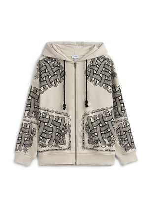 Beige hoodie met ritssluiting, voorzien van zwarte abstracte geweven touwontwerpen op de schouders, voorzakken, mouwen en zwarte trekkoorden aan de capuchon.
