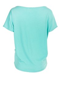 A loose-fitting, short-sleeve t-shirt in a light turquoise shade, made from soft, smooth fabric with a rounded hemline.