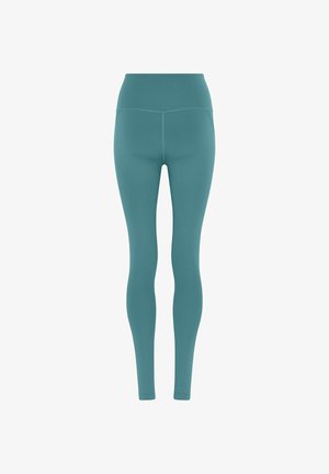 Tumesinised sirged täispikkuses ülakeha säärised õmbluste detailidega, mõeldud aktiivrõivasteks või igapäevaseks kandmiseks, valgel taustal.