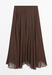 Jupe midi marron à pois noirs, ourlet asymétrique fluide et fermeture éclair cachée au dos.