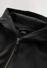 THROUGH  - Sweater met rits - black
