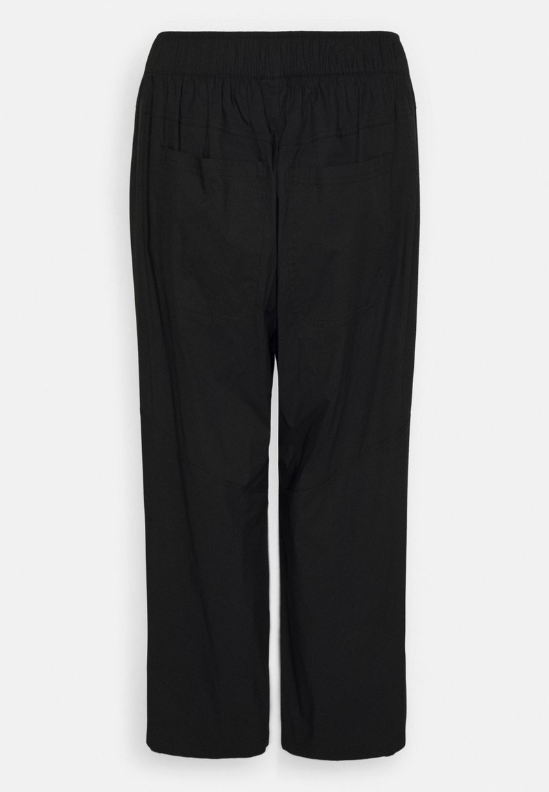 Schwarze, lockere Hose mit elastischem Bund, ausgestattet mit zwei Gesäßtaschen und einem glatten, leichten Stoff.