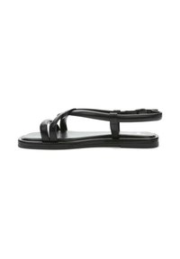 Black flat sandals featuring cross straps, a smooth leather finish, and an adjustable ankle strap. Simple, minimalistic design.