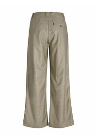 Pantalons large en toile kaki clair avec un tissu texturé, dotés d'une fermeture éclair, d'une poche arrière et d'une taille cintrée.