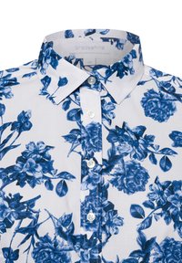 Biała koszula z guzikiem z niebieskim wzorem kwiatowym, z klasycznym kołnierzykiem i listwą z guzikami z przodu. Wykonana z gładkiej bawełny.