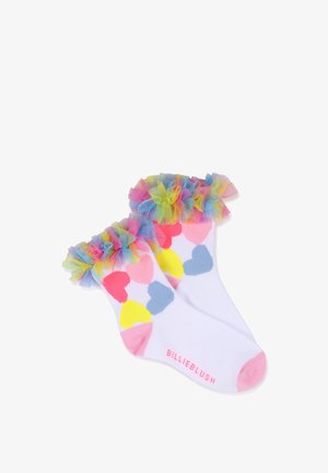Chaussettes blanches avec des motifs de cœurs colorés en rose, jaune et bleu ; ornées d'un bord en tulle froncé multicolore vibrant. "BILLIEBLUSH" imprimé en rose.