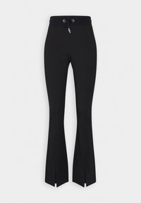 Black flared pants with a drawstring waistband, side slits at the hem, made from a smooth, flexible fabric. Minimalist design.