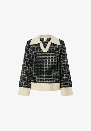 Svart og hvit mønstret genser med v-hals og kremfarget krage. Strikket tekstur, lange ermer og ribbet kant.