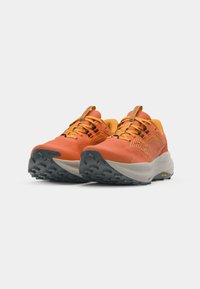 Trail running shoes in vibrant orange and yellow. Textured upper, lightweight design, molded sole with grip pattern, and branded accents.