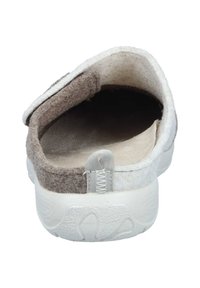 Wool slip-on shoe with a soft brown and white exterior, round toe, rubber sole, and a small fabric loop at the heel for easy wear.