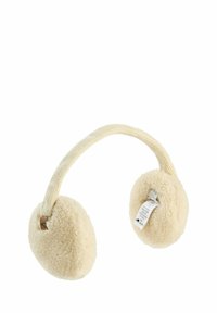 Cache-oreilles beige avec un design en polaire doux et texturé, et un bandeau en tissu tissé. Étiquette visible sur un côté.