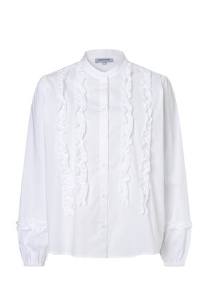 White long-sleeve blouse with a stand collar, front button closure, vertical ruffle details, and elastic cuffs with small ruffles.