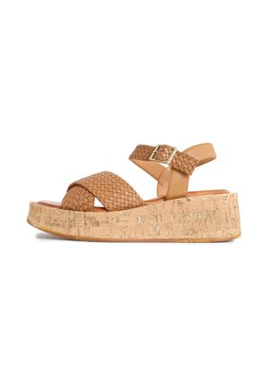 Tan woven leather wedge sandal with ankle strap and gold buckle, cork platform sole, side view on white background.