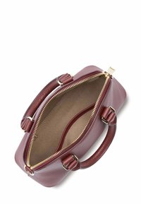 Borsa a mano in pelle marrone con zip dorata, due manici corti e un ampio interno con una fodera texturizzata.