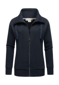 Námornícky modrá mikina na zips vyrobená z mäkkej látky. Má vysoký golier, ribbované manžety a dva šnúrkové detaily na zips.