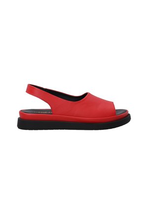 Red leather slingback sandal with an open toe, black sole, smooth texture, and minimalistic design. Features a low, contouring platform.