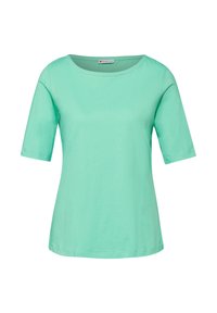 Mátově zelené tričko s krátkým rukávem a kulatým výstřihem, vyrobené z měkkého bavlněného materiálu, s uvolněným střihem a jemně zakončenými okraji.