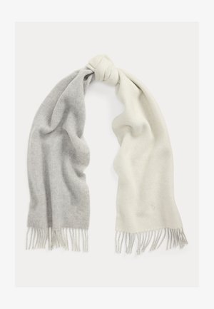 Wool scarf featuring a gradient from gray to white, with a soft texture and fringed edges. The fabric appears warm and cozy.