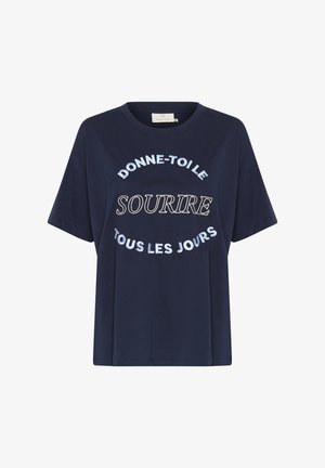 T-shirt en coton bleu marine à manches courtes. Inclus un texte brodé blanc : "DONNE-TOILE", "SOURIRE", et "TOUS LES JOURS". Col rond.