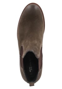 Hnědé kožené kotníkové boty s elastickými postranními panely, zaoblenou špičkou a texturovaným povrchem. Uvnitř se nachází logo na stélce.