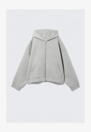 Sweatshirt cinza com fecho éclair, feito de uma mistura de algodão macio, com capuz, bolsos canguru e punhos canelados. Ajuste oversized relaxado.