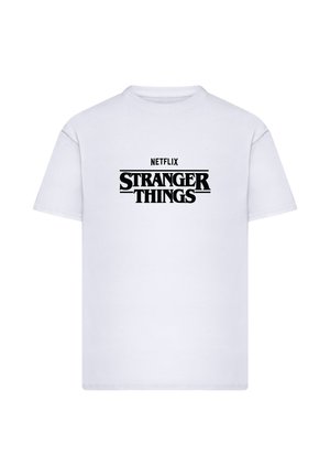 Valkoinen puuvillainen t-paita, jossa mustat "NETFLIX"-teksti ja "STRANGER THINGS" -logo. Pyöreä pääntie ja lyhyet hihat, klassinen malli.