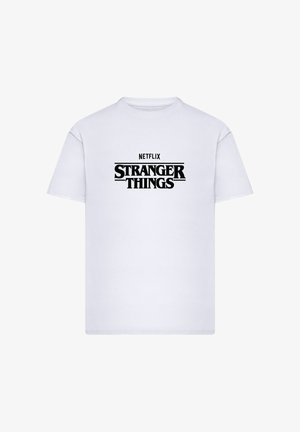 Valkoinen puuvillainen t-paita, jossa mustat "NETFLIX"-teksti ja "STRANGER THINGS" -logo. Pyöreä pääntie ja lyhyet hihat, klassinen malli.