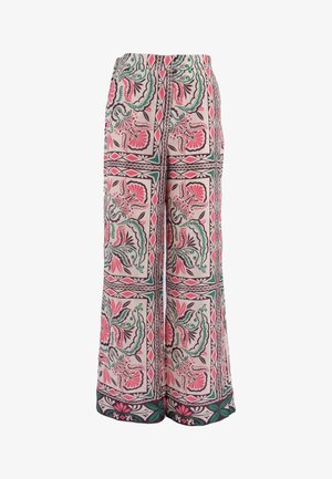 Pantalon à jambes larges avec motifs floraux et géométriques roses, verts et noirs sur un fond beige clair.