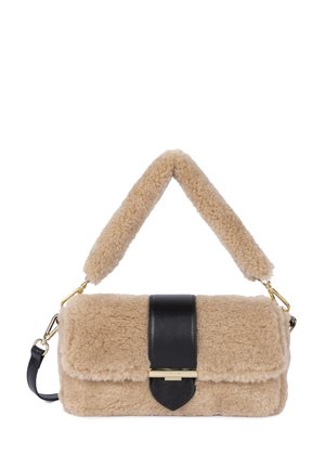 Beige fluffy handbag with a black leather strap and closure. Features a gold hardware accent and soft, textured exterior.