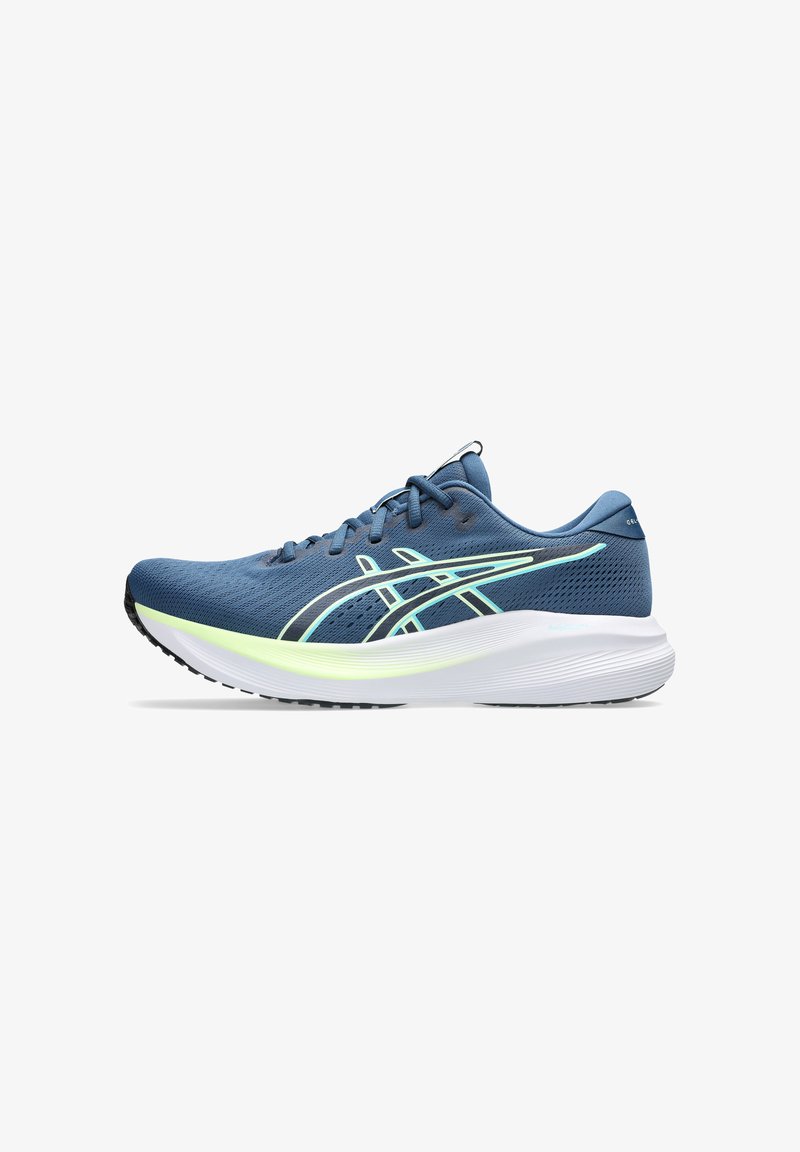 Blue athletic running shoe with light green and white detailing, cushioned white sole, and lace-up design, shown in side profile.