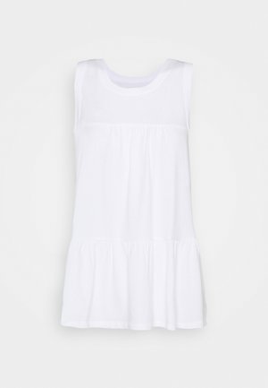 Haut blanc sans manches en coton, avec un col rond, une couture froncée sous la poitrine et un ourlet évasé. Texture lisse.