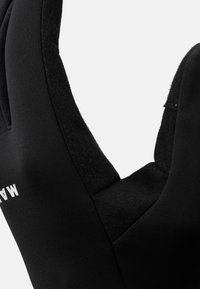 Black neoprene glove with a textured interior and smooth exterior, featuring an open cuff design and white branding on the wrist.